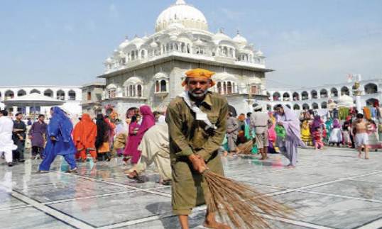 Description: Karamat Masih, a Christian sanitary worker at Gurdwara Punja Sahib, serves the temple round the clock to ensure cleanliness is maintained. He said he is proud to serve this holy place and the devotion of thousands to their faith, inspires him.