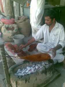 Worker busy in Lakh-wooden Polish preparation 