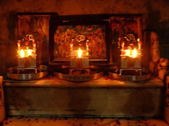 Description: Lamps are burnt inside the temple.