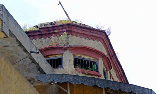 Description: A vigilance tower on the building harks back to the days when it served as a jail. — Photos by Khurram Amin