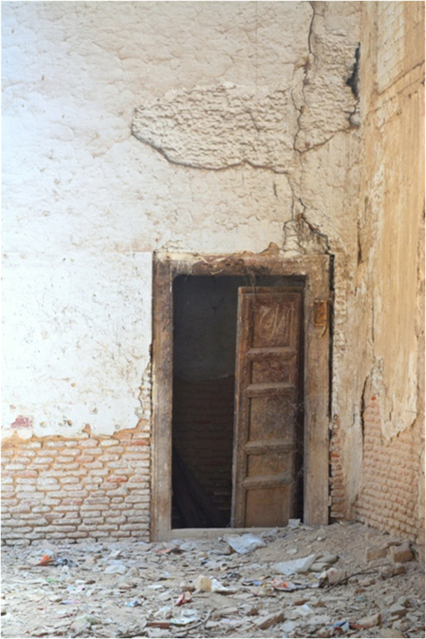 Description: The door leading to the basement now is covered with cobwebs