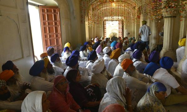 Description: Pilgrims gathered to pray at the 176th death anniversary of Maharaja Ranjit SIngh. -AFP