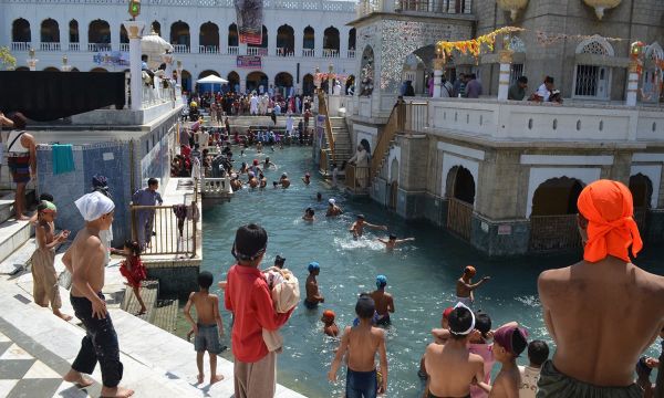 Description: Pilgrims bathe in holy water.