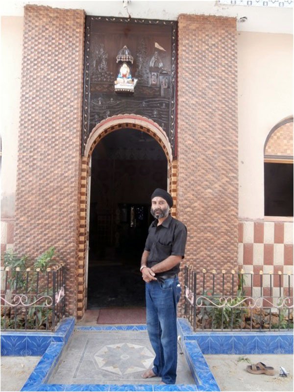 Description: Suresh Kumar Lohana standing near the entrance