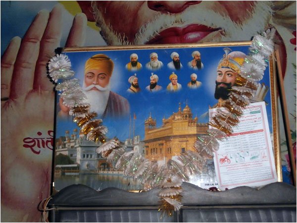 Description: The poster showing images of Baba Guru Nanak and other gurus