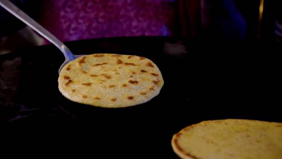 Description: The roti is cooked on low flame. — Photo by Khurram Amin