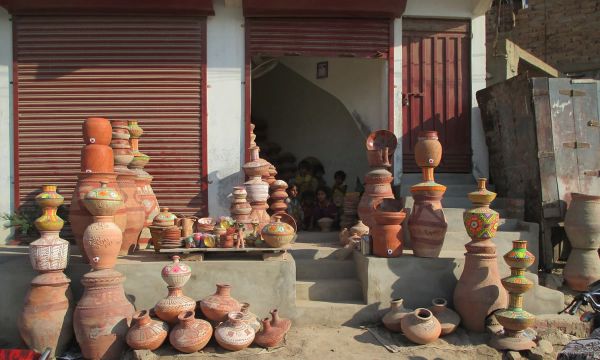 Description: A local market displaying traditional pots for sale. — Photo by Hanif Samoon