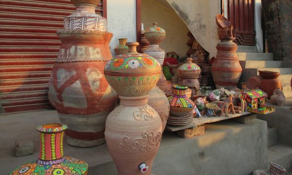 Description: Various colorful pots and toys on display at a local market. — Photo by Hanif Samoon