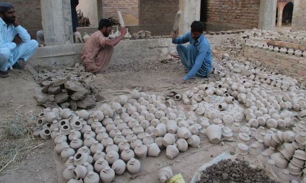 Description: Local potters working. — Photo by Hanif Samoon