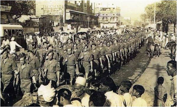 Description: Units of the Royal Irish Infantry Regiment are deployed to restore order in Lahore, 1947