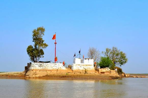 Description: Khwaja Khizar's shrine as seen from the boat.