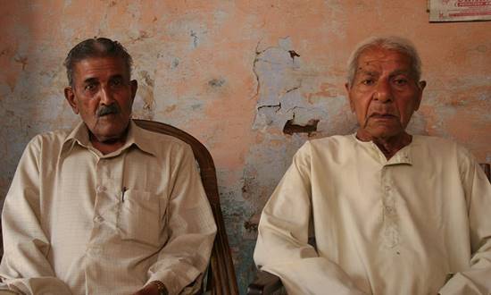 Description: Pundit Fakir Chand Sangar (left) , who remembers Rashid’s grandfather, with his brother in Ughi