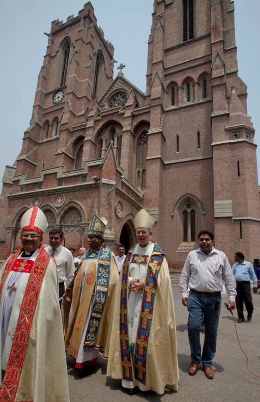 Description: The Archbishop of Canterbury (second from right), the most senior bishop of the Church of England, and others at the Anglican cathedral in Lahore in 2014. (Photo credit: Reuters).