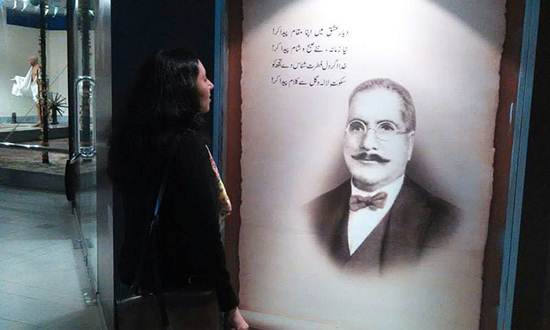 Description: Description: The author attempts to read Iqbal at the Pakistan Monument museum.