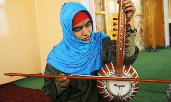 Description: When Kashmiri teenager Shabnam Bashir first took up classical Sufi music three years ago, she had to practise singing in secret because all the men in her Muslim family opposed her new passion. — AFP