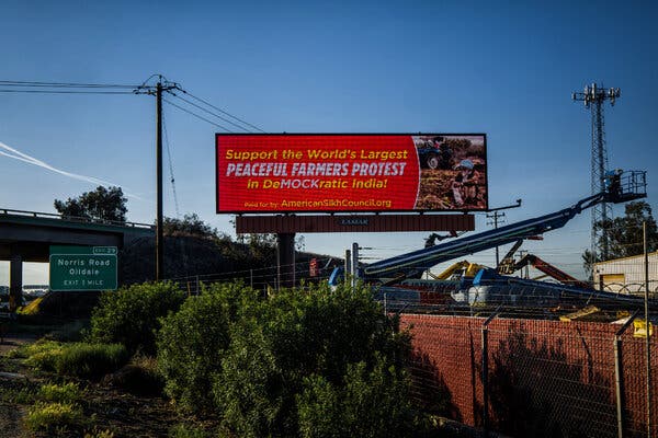 Description: A billboard supporting farmers in India is displayed on Route 99 in Shafter, Calif.